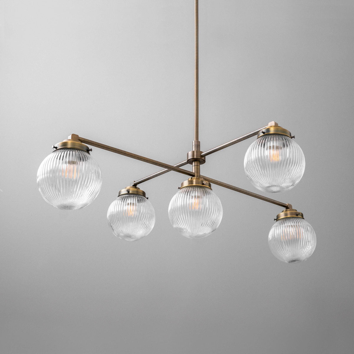 Modern Victorian chandelier with five ribbed glass globe shades and antique brass finish. - CHANDELIER MODEL NO. 3646