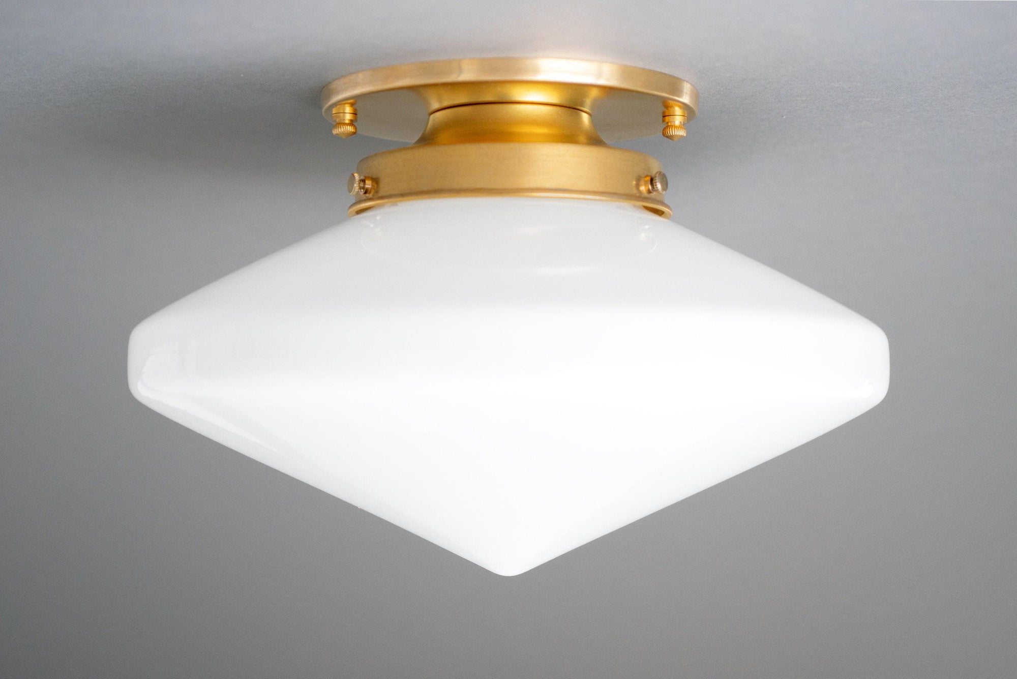 Flush mount ceiling light with white glass globe and raw brass fixture. - CEILING LIGHT MODEL NO. 5862