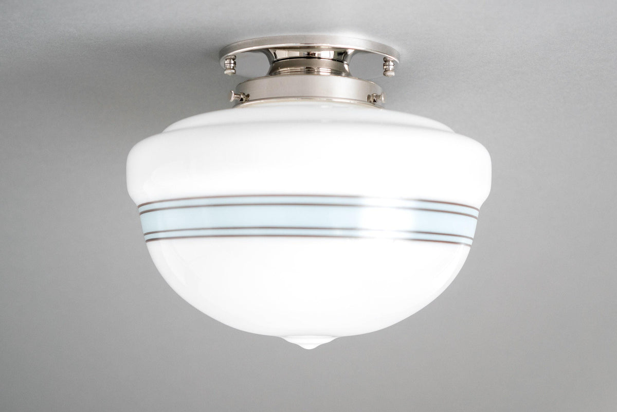 Art Deco flush mount ceiling light with polished nickel finish and white glass globe with blue stripes. - CEILING LIGHT MODEL NO. 9927