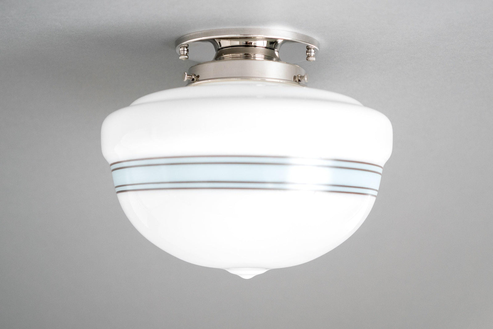 Art Deco flush mount ceiling light with polished nickel finish and white glass globe with blue stripes. - CEILING LIGHT MODEL NO. 9927