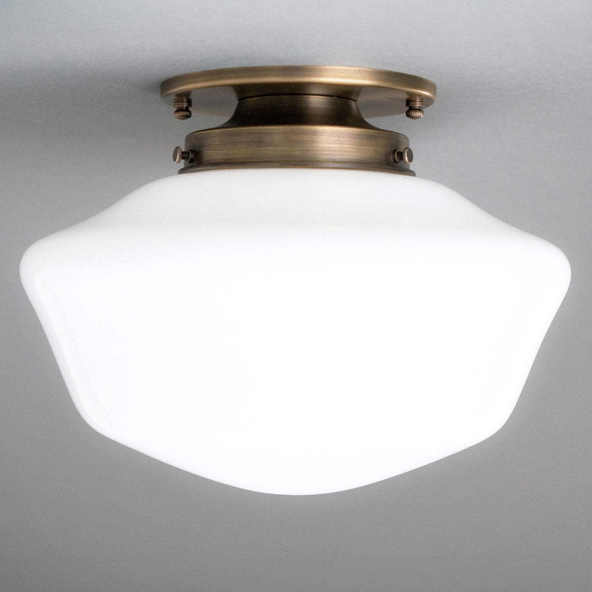 Flush mount ceiling light with antique brass fixture and white frosted glass globe shade. - CEILING LIGHT MODEL NO. 4340