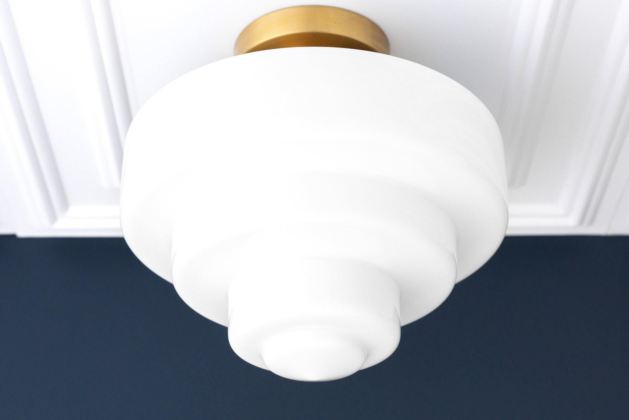 Art Deco flush mount ceiling light with tiered white glass globe and brass base. - CEILING LIGHT MODEL NO. 7458