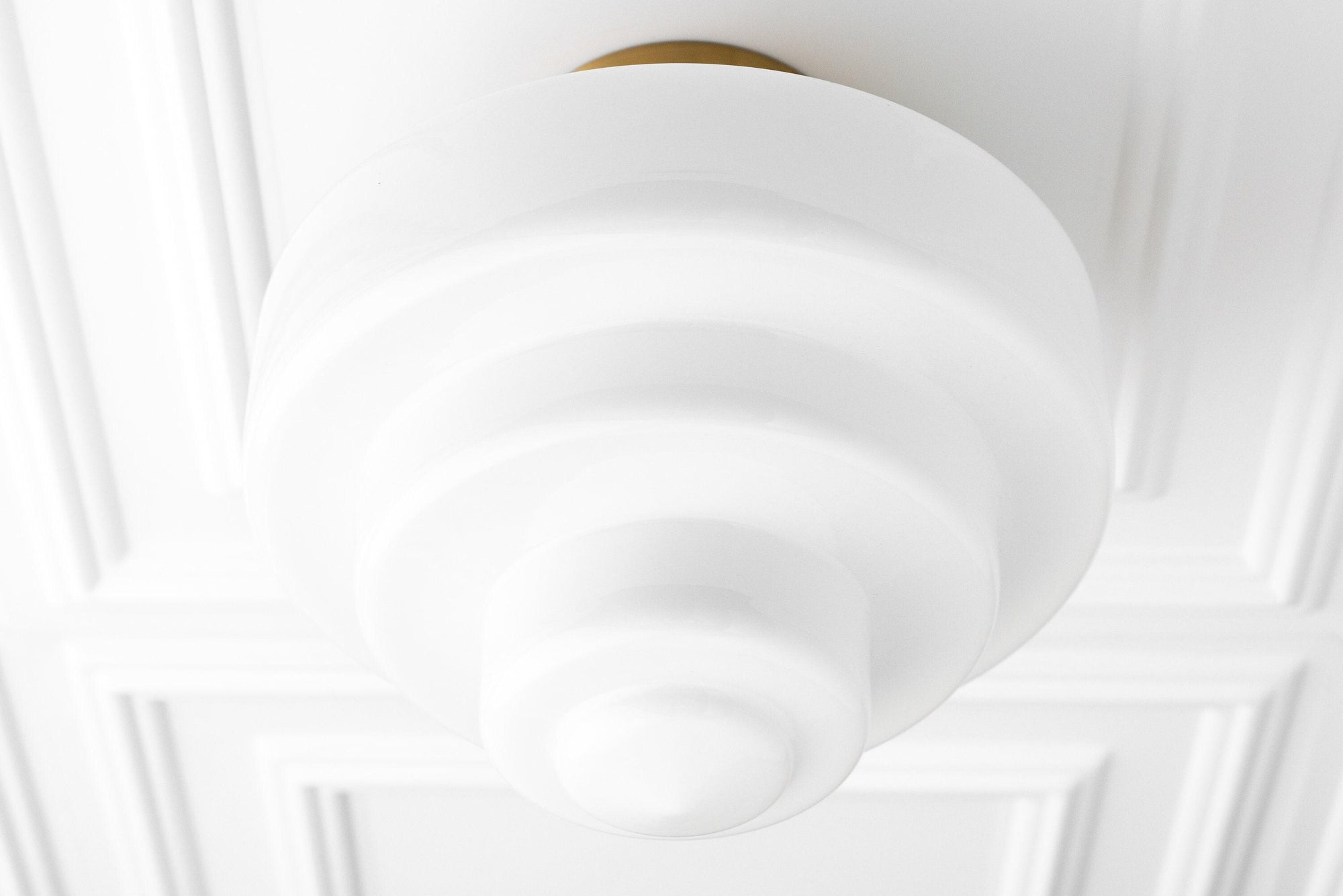 Art Deco flush mount ceiling light with tiered white glass globe and brass base. - CEILING LIGHT MODEL NO. 7458