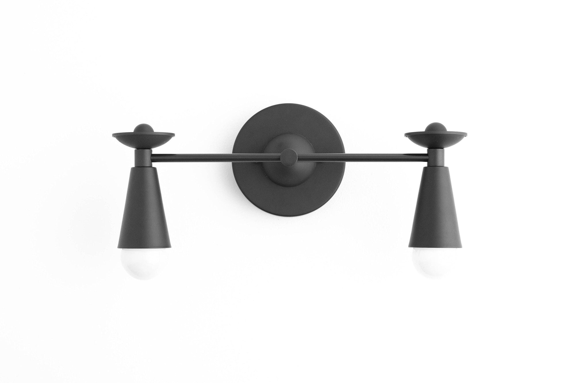 Black metal Art Deco vanity light with two tapered conical shades and exposed bulbs. - VANITY LIGHT MODEL NO. 4517