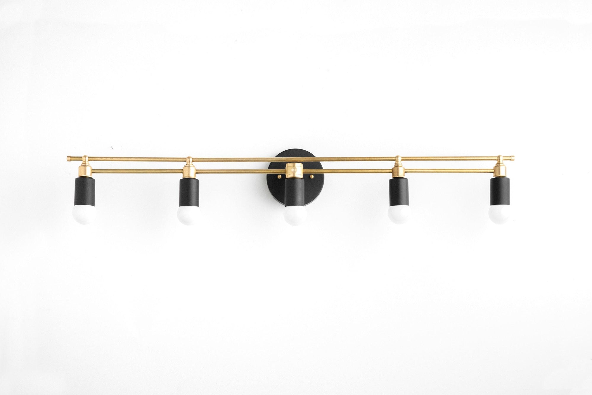 Art Deco vanity light with five black and brass bare bulb sockets and horizontal bar mount. - VANITY LIGHT MODEL NO. 3933