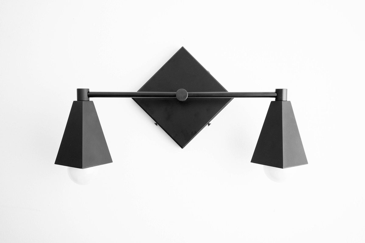 Black Art Deco vanity light with two tapered shades and diamond-shaped backplate. - VANITY LIGHT MODEL NO. 4237