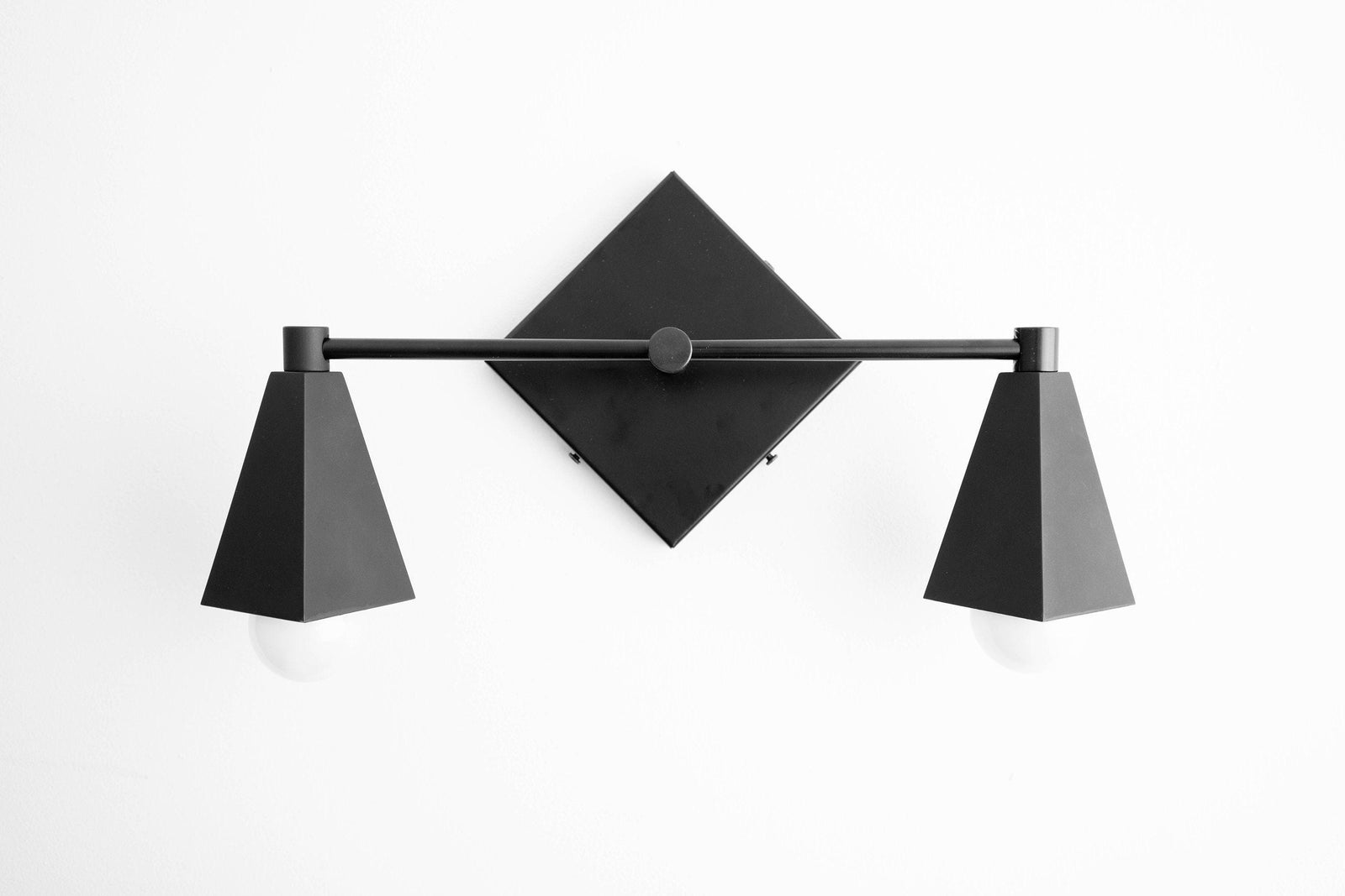 Black Art Deco vanity light with two tapered shades and diamond-shaped backplate. - VANITY LIGHT MODEL NO. 4237