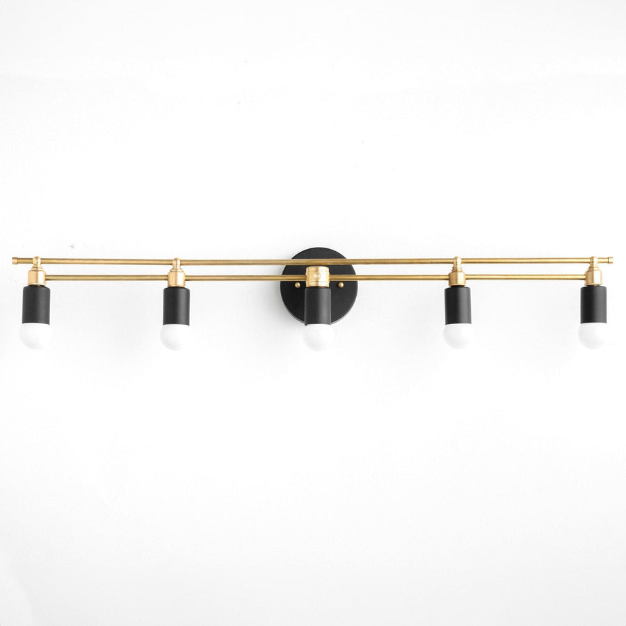 Art Deco style vanity light with five black and brass bare bulb sockets on a horizontal brass bar. - VANITY LIGHT MODEL NO. 3933