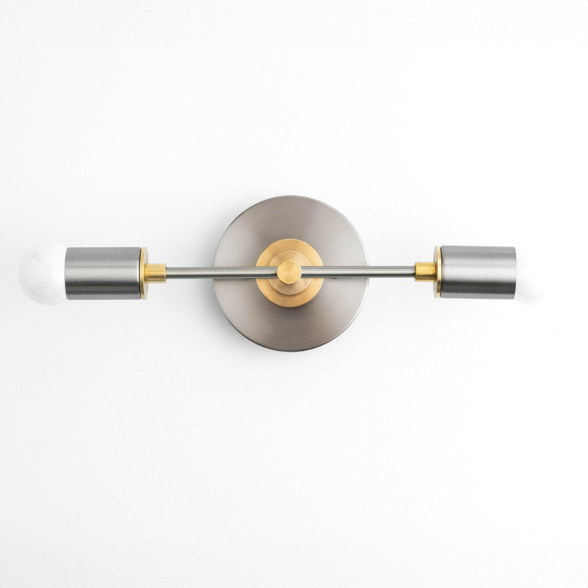 Art Deco vanity light with brushed nickel finish, raw brass accents, and two cylindrical bulbs. - VANITY LIGHT MODEL NO. 8057
