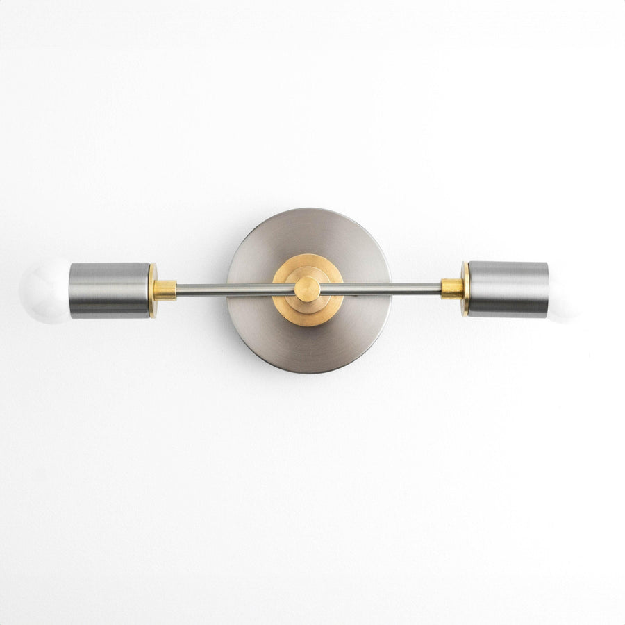 Art Deco vanity light with brushed nickel finish, raw brass accents, and two cylindrical bulbs. - VANITY LIGHT MODEL NO. 8057