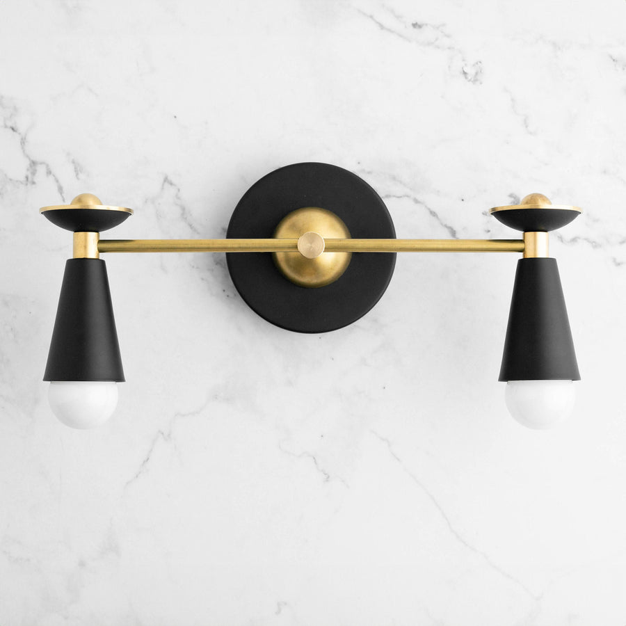 Art Deco style vanity light with black conical shades and raw brass horizontal bar and round wall mount. - VANITY LIGHT MODEL NO. 4517