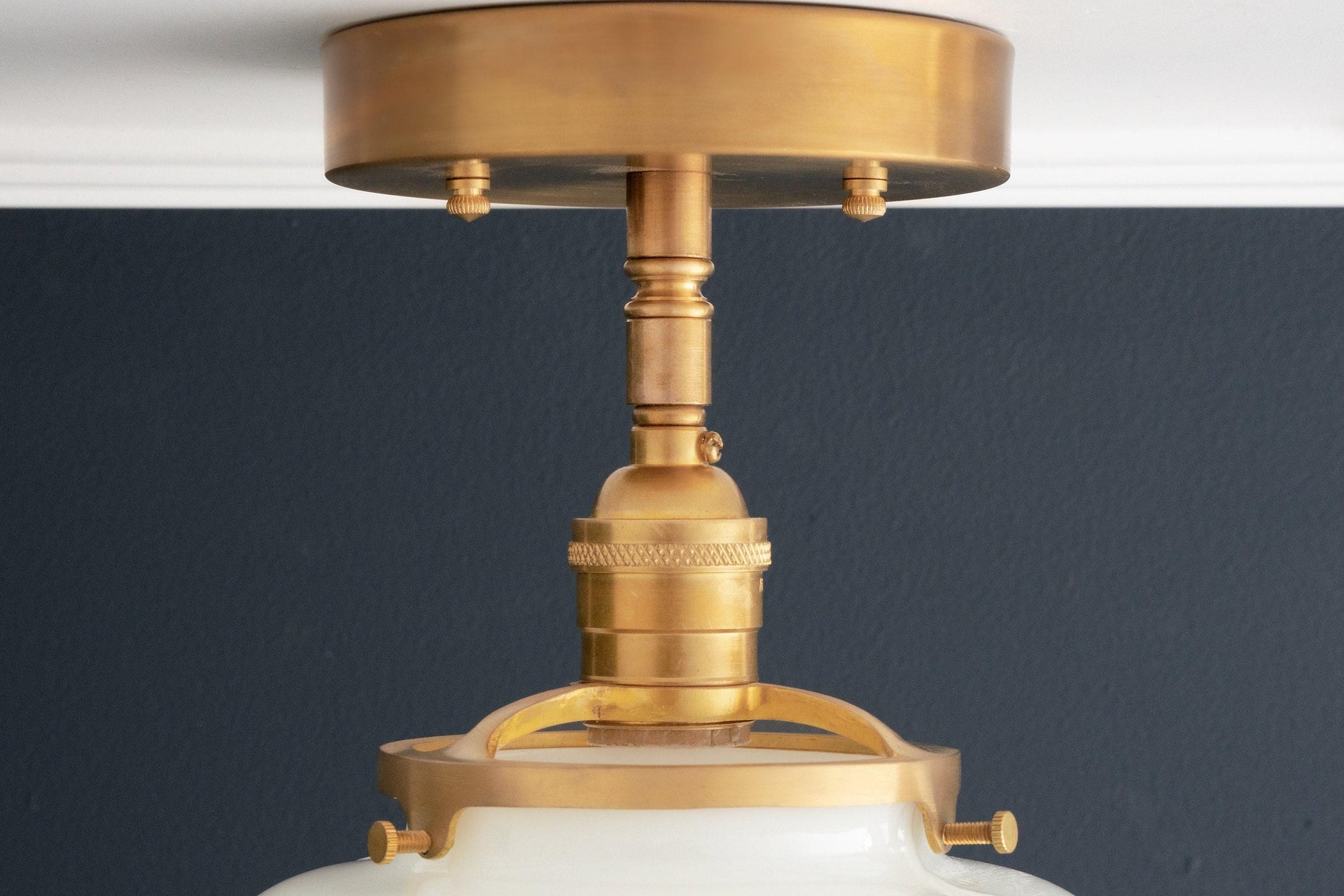 Raw brass semi-flush ceiling light with globe-shaped frosted glass shade and industrial design. - CEILING LIGHT MODEL NO. 4560