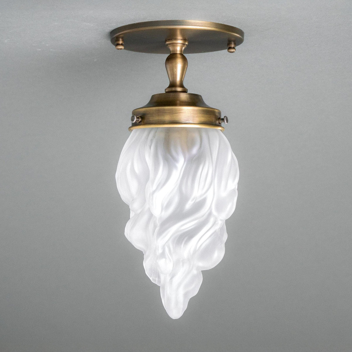 Flush ceiling light in Antique Brass with a frosted glass flame shade. - CEILING LIGHT MODEL NO. 6131
