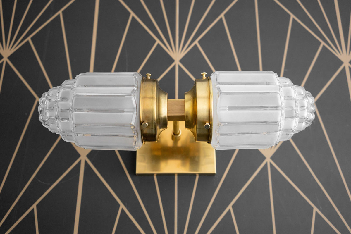 Art Deco brass wall sconce with two textured frosted glass globes and square backplate. - SCONCE MODEL NO. 7180