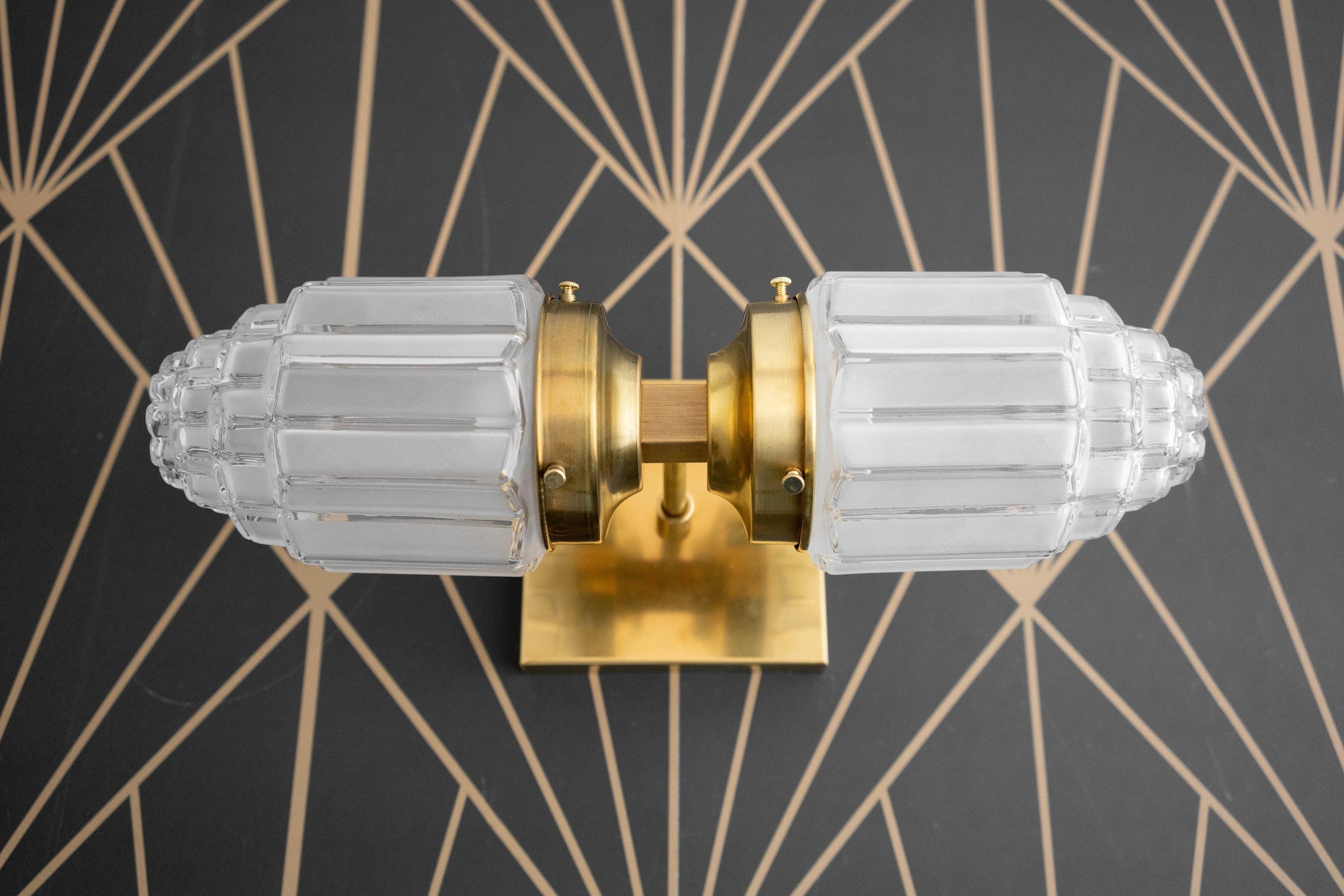 Art Deco brass wall sconce with two textured frosted glass globes and square backplate. - SCONCE MODEL NO. 7180