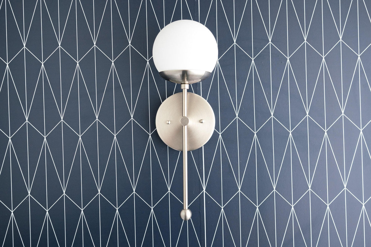 Wall-mounted Art Deco sconce with white globe shade and brushed nickel finish. - SCONCE MODEL NO. 1048