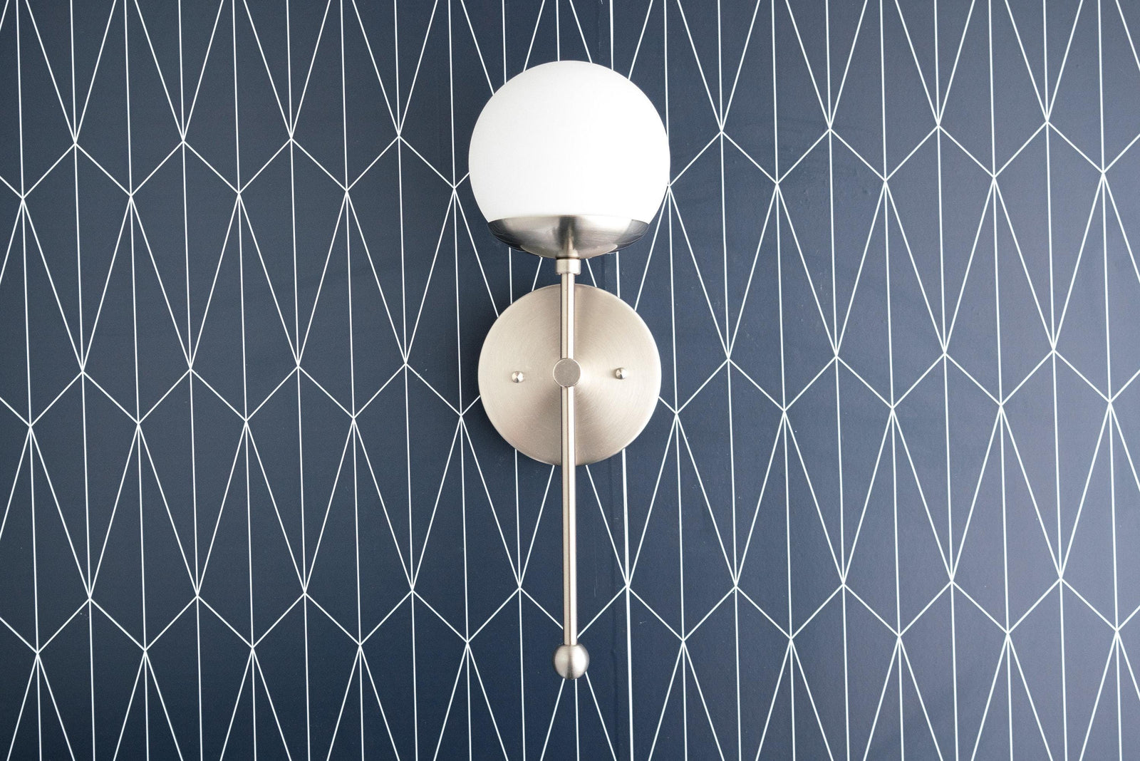 Wall-mounted Art Deco sconce with white globe shade and brushed nickel finish. - SCONCE MODEL NO. 1048
