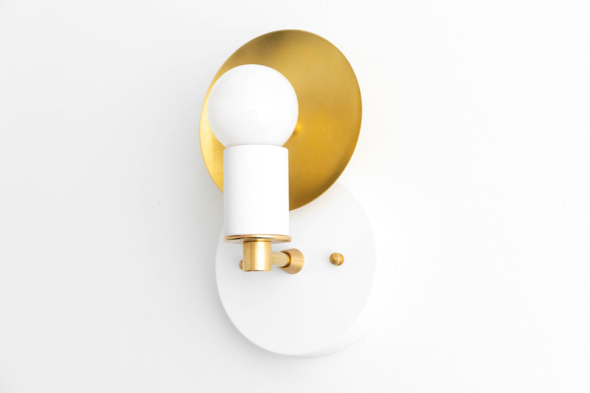 Art Deco wall sconce with white and brass circular backplates and exposed bulb design. - SCONCE MODEL NO. 8677