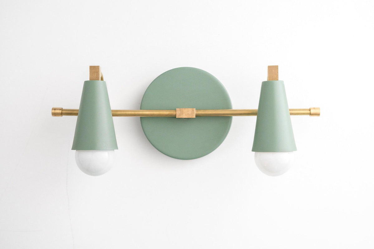 Two-bulb vanity light with matte green cone shades and raw brass horizontal bar on round green base. - VANITY LIGHT MODEL NO. 1229