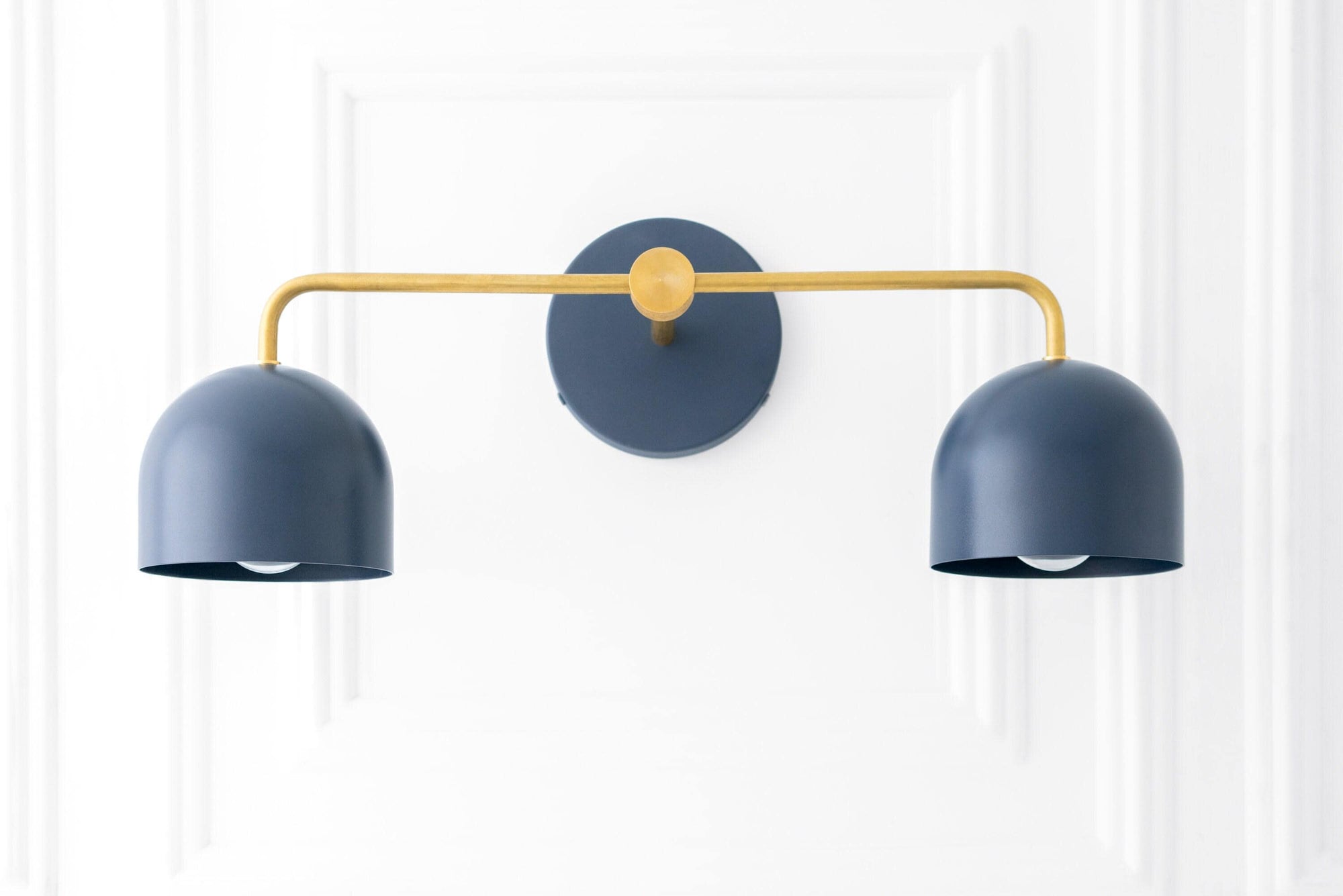 Mid-century modern vanity light with two matte coal blue dome shades and a raw brass horizontal arm and wall mount. - VANITY LIGHT MODEL NO. 2082