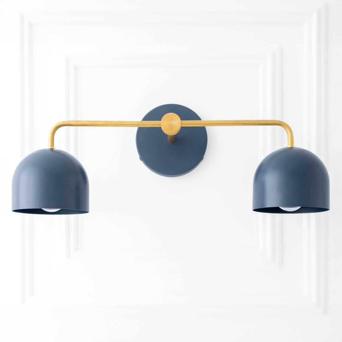 Art Deco style two-bulb vanity light with coal blue dome shades and brass horizontal mounting bar. - VANITY LIGHT MODEL NO. 2082