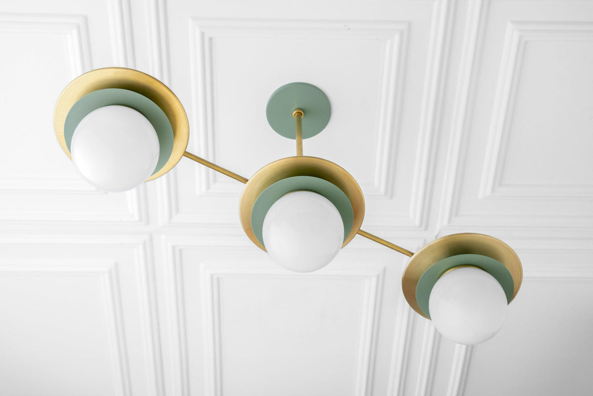 Mid-century modern chandelier with three green and brass globe lights on a white coffered ceiling. - CHANDELIER MODEL NO. 7967