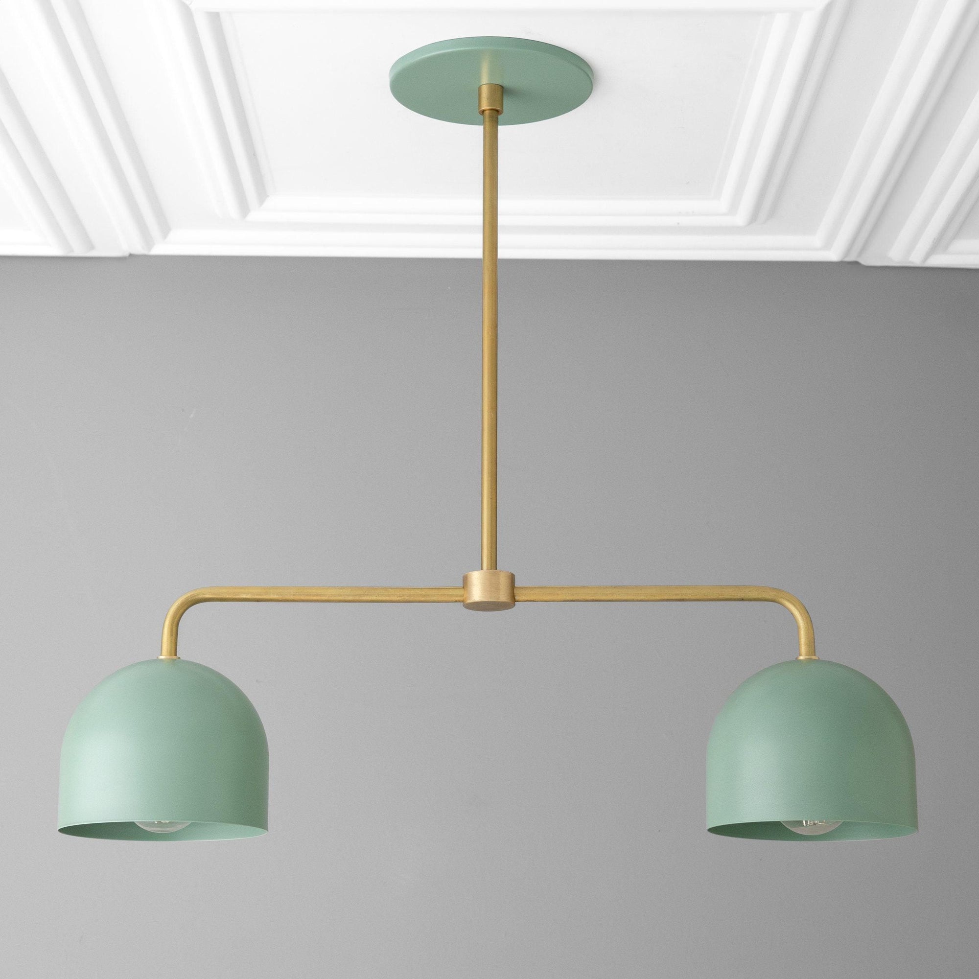 Green industrial-style chandelier with two dome-shaped shades and brass horizontal rod suspension. - CHANDELIER MODEL NO. 5719