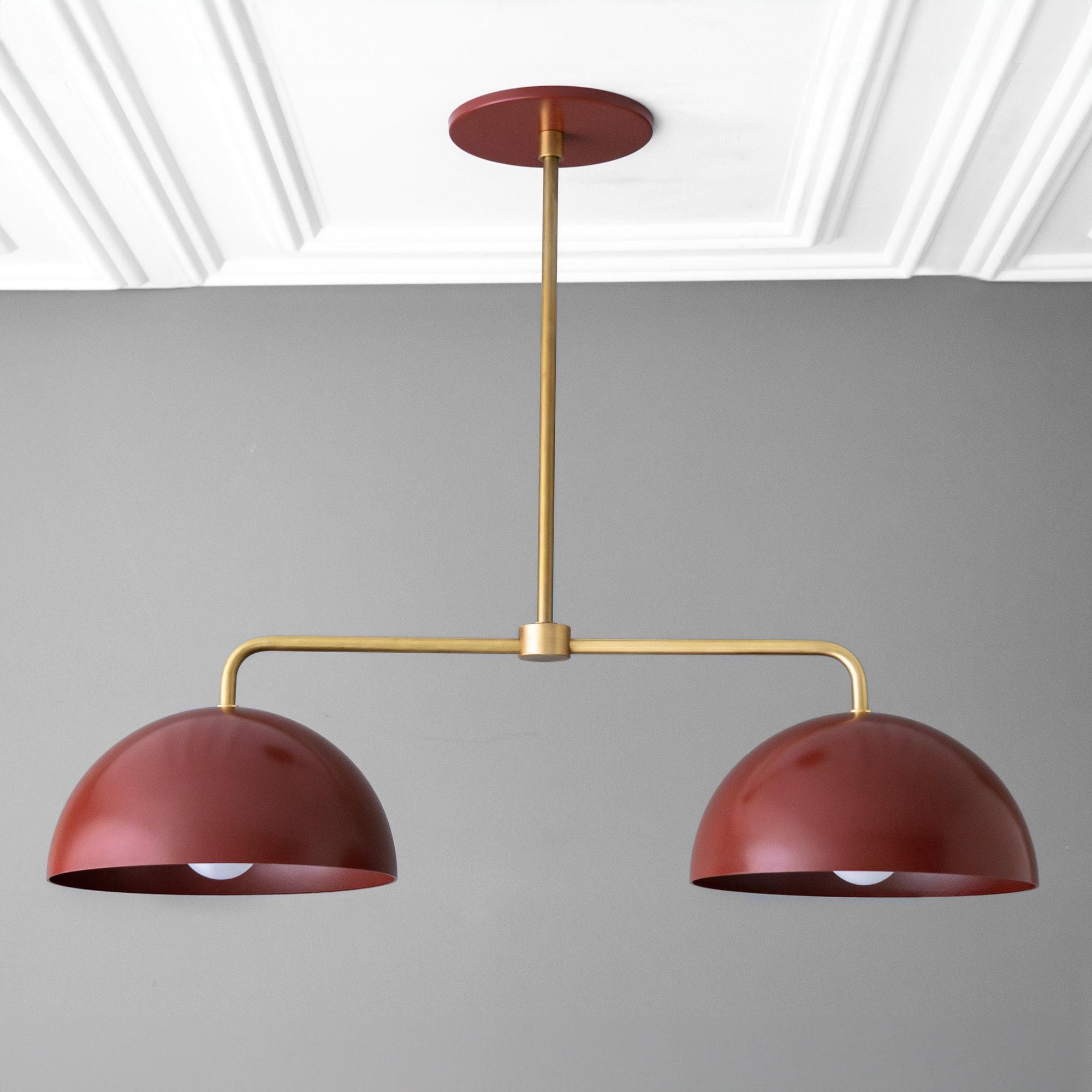 Mid-century modern chandelier with two red dome shades and raw brass horizontal and vertical rods. - CHANDELIER MODEL NO. 5391