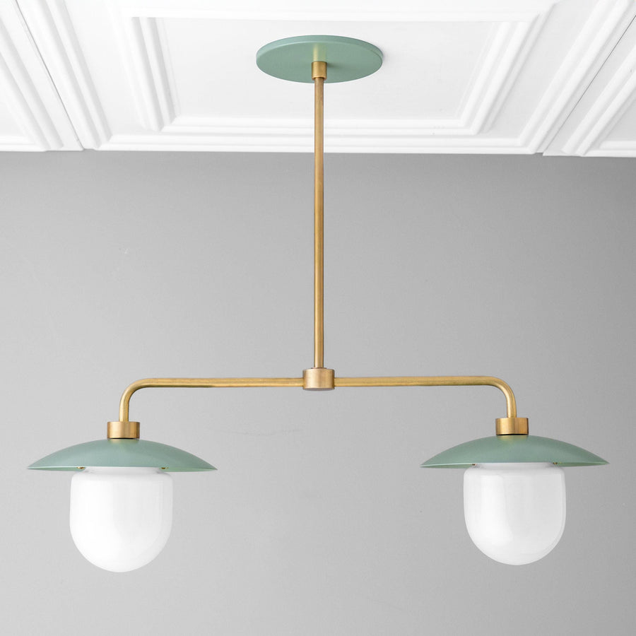 Mid-century modern chandelier with green metal shades, white globe bulbs, and brass finish rod. - CHANDELIER MODEL NO. 1727