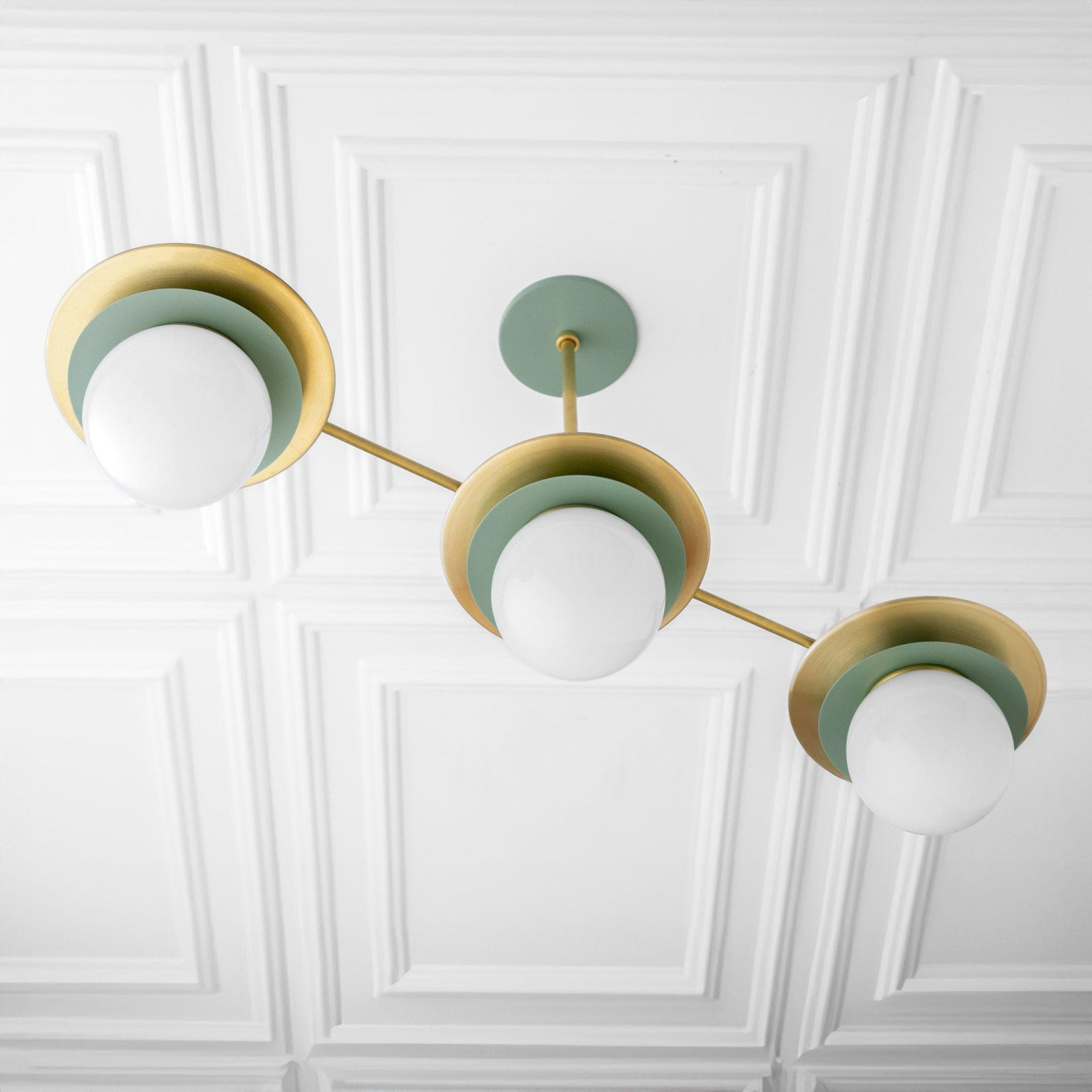 Mid-century modern chandelier with raw brass arms and green circular accents holding white globe bulbs. - CHANDELIER MODEL NO. 7967