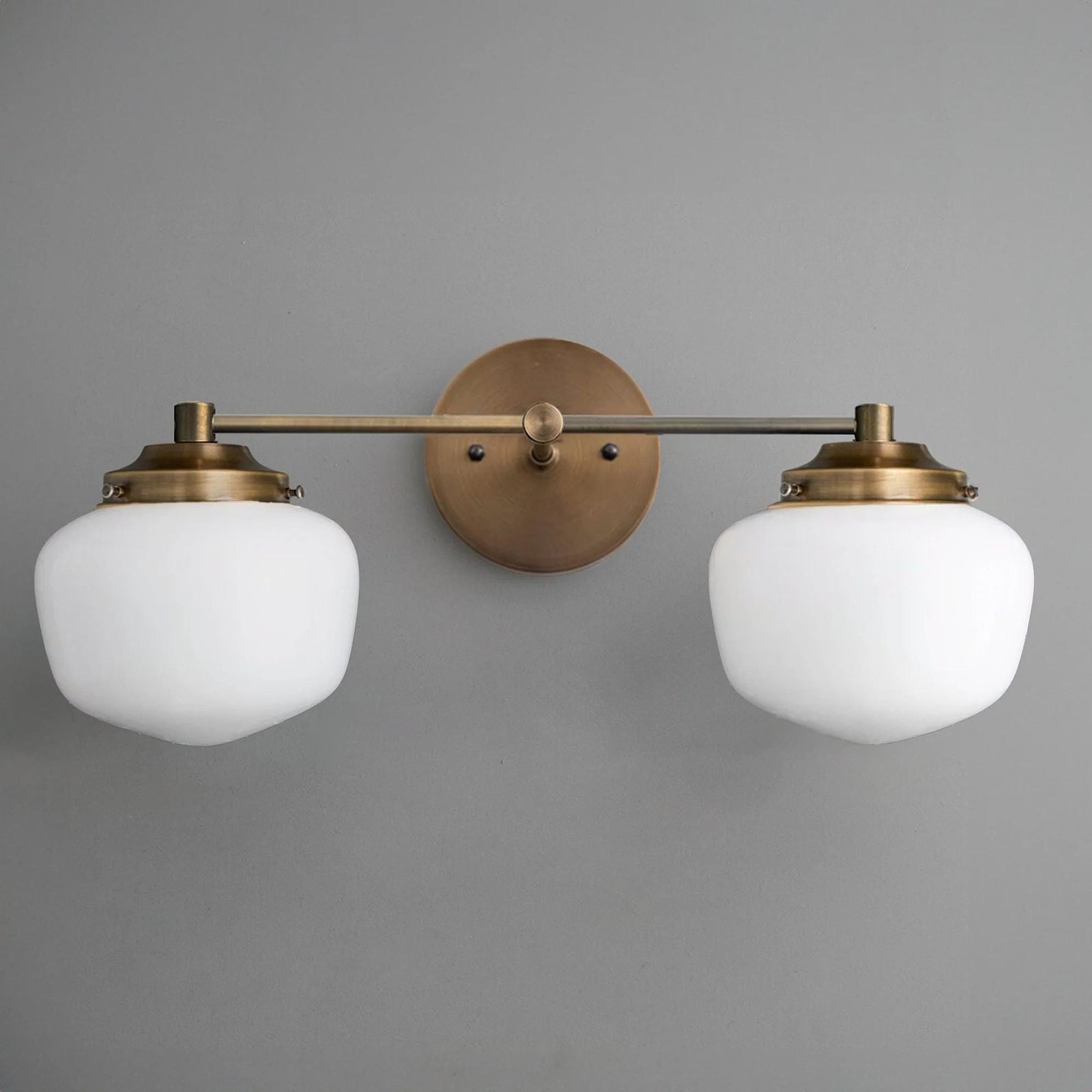 Mid-century modern 2-bulb vanity light with brushed brass finish and white glass globes. - VANITY LIGHT MODEL NO. 5799