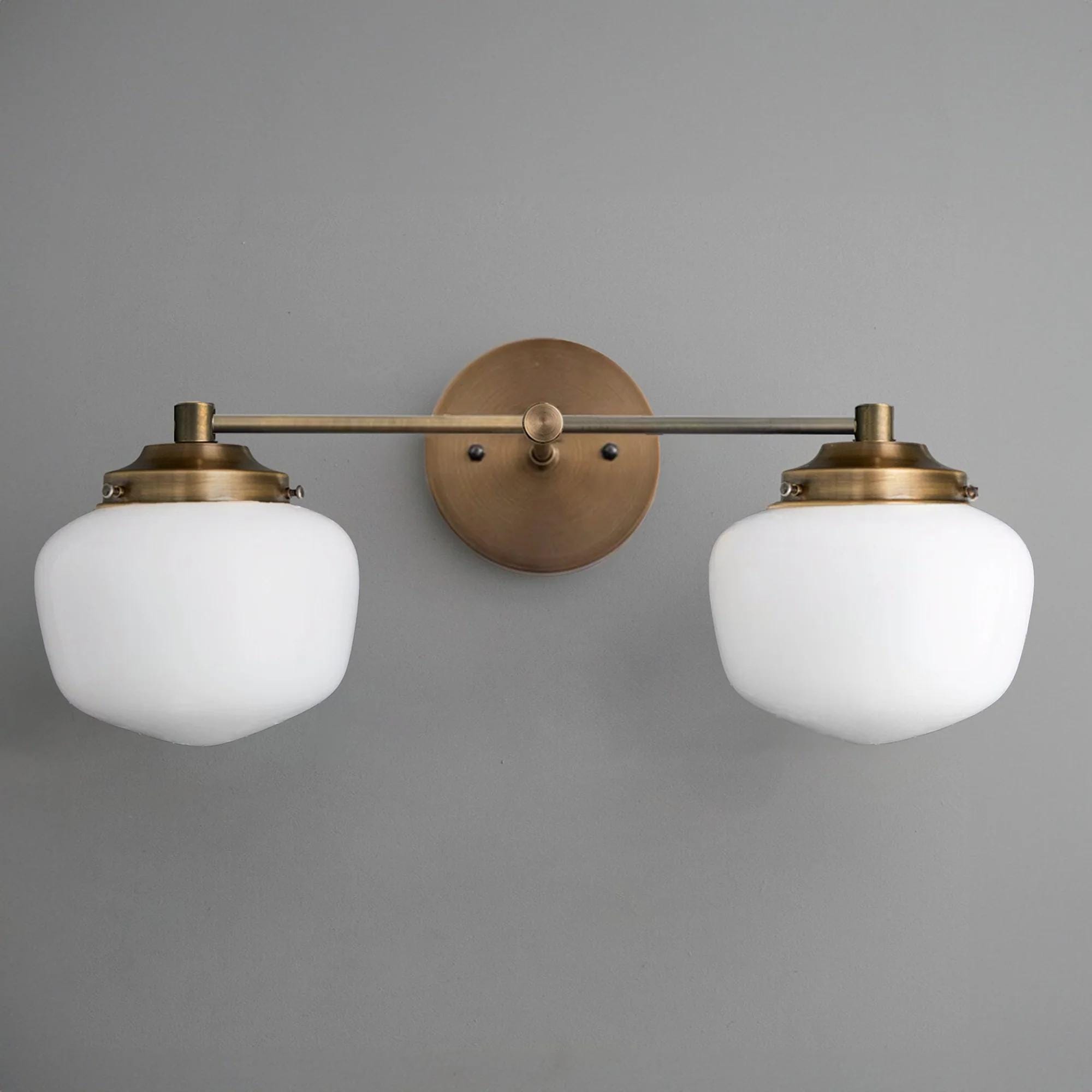 Mid-century modern 2-bulb vanity light with brushed brass finish and white glass globes. - VANITY LIGHT MODEL NO. 5799
