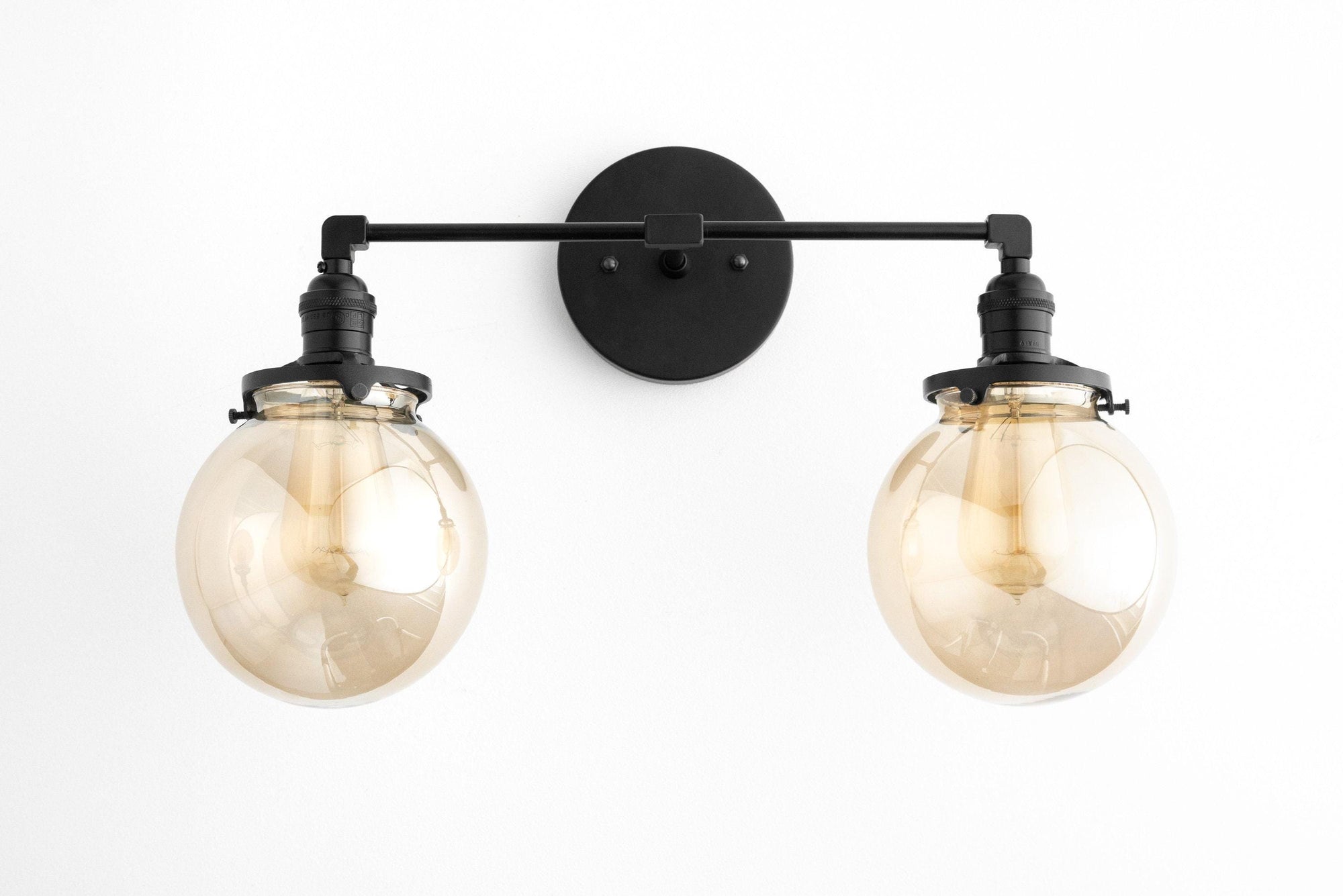 Mid-century modern black vanity light with two clear globe bulbs and metal wall mount. - VANITY LIGHT MODEL NO. 4270