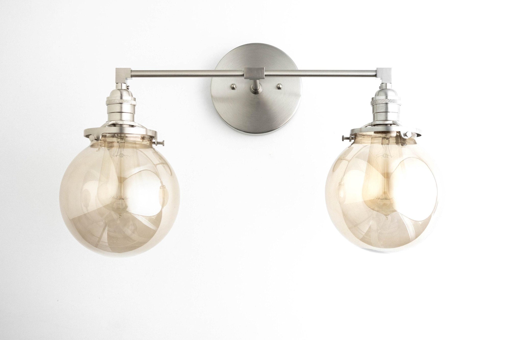 Mid-century modern 2-bulb vanity light with brushed nickel finish and clear globe shades. - VANITY LIGHT MODEL NO. 4270