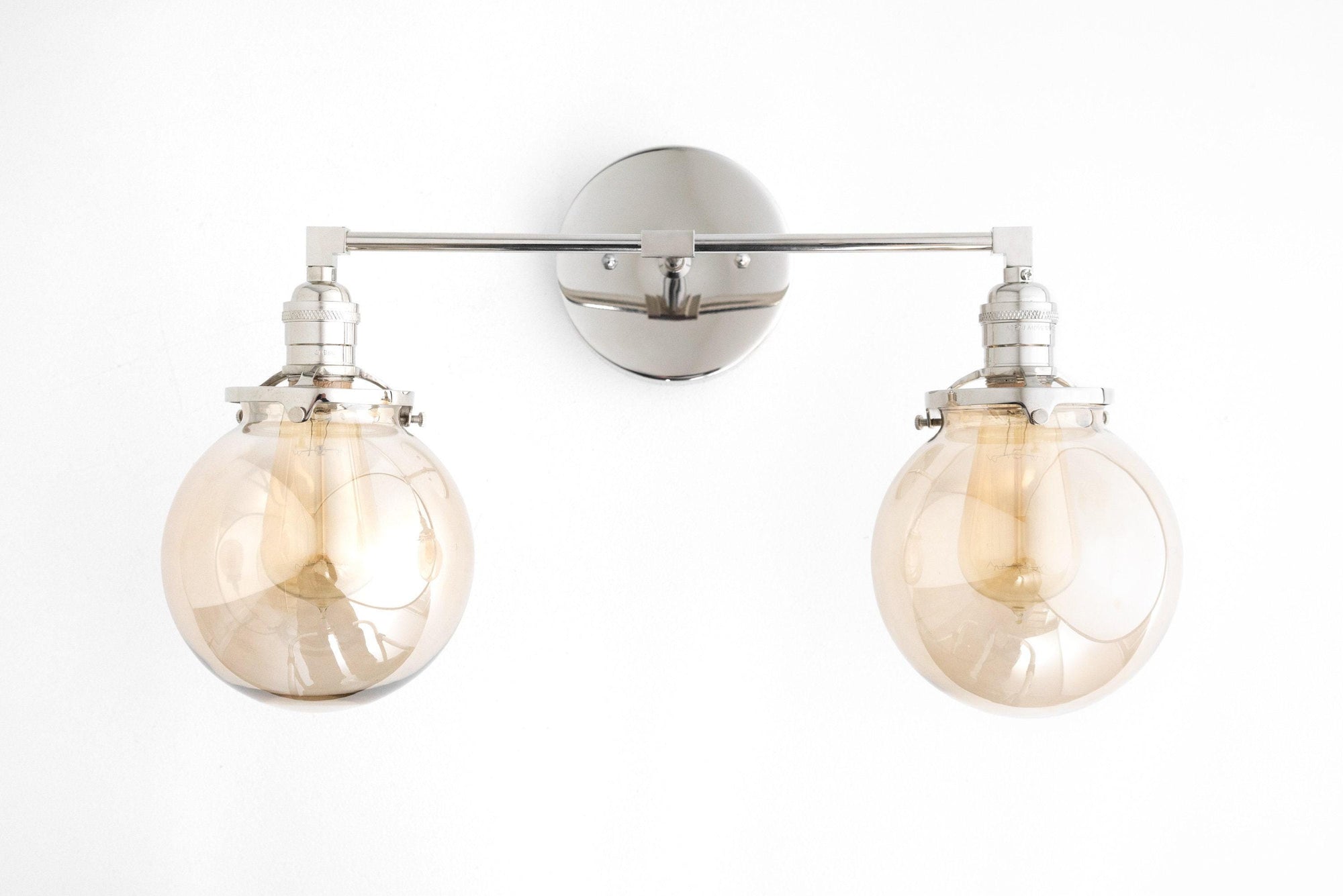 Mid-century modern vanity light with brushed nickel finish and two amber globe bulbs. - VANITY LIGHT MODEL NO. 4270