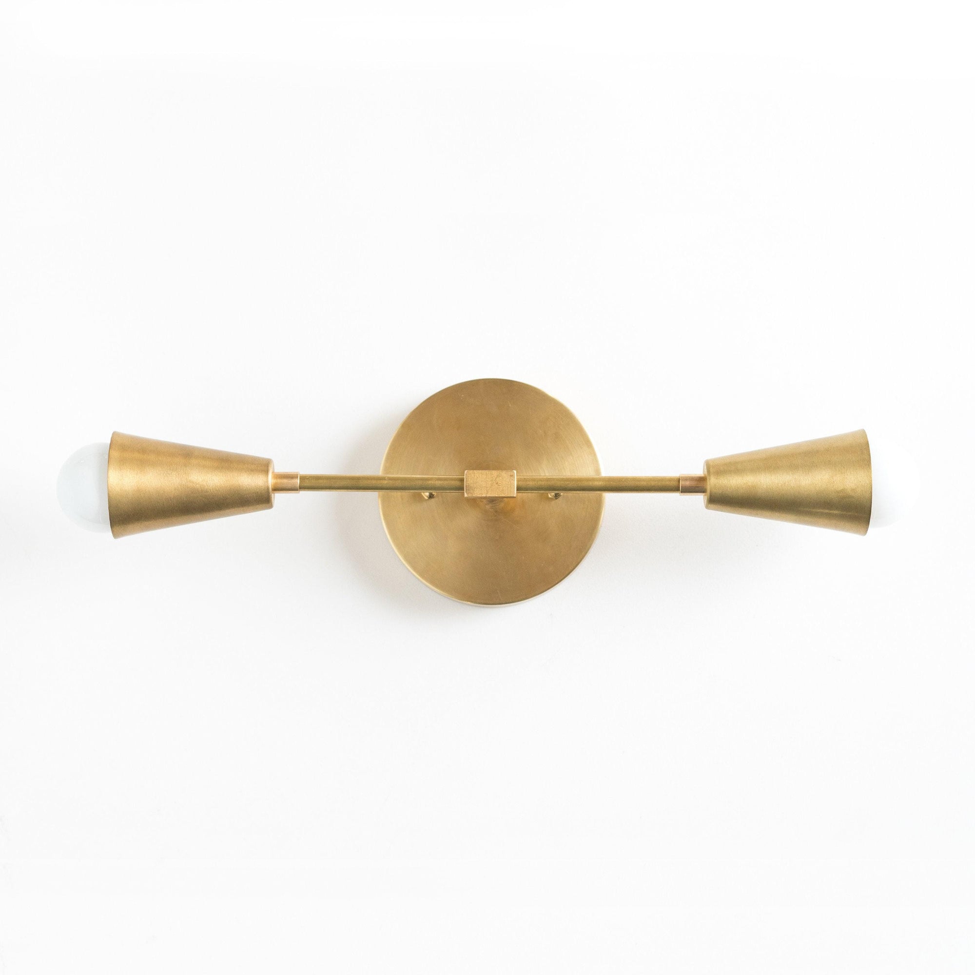 Mid-century modern 2-bulb vanity light in raw brass with cone-shaped shades. - VANITY LIGHT MODEL NO. 3209