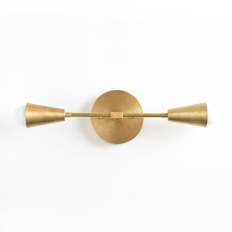 Mid-century modern 2-bulb vanity light in raw brass with cone-shaped shades. - VANITY LIGHT MODEL NO. 3209