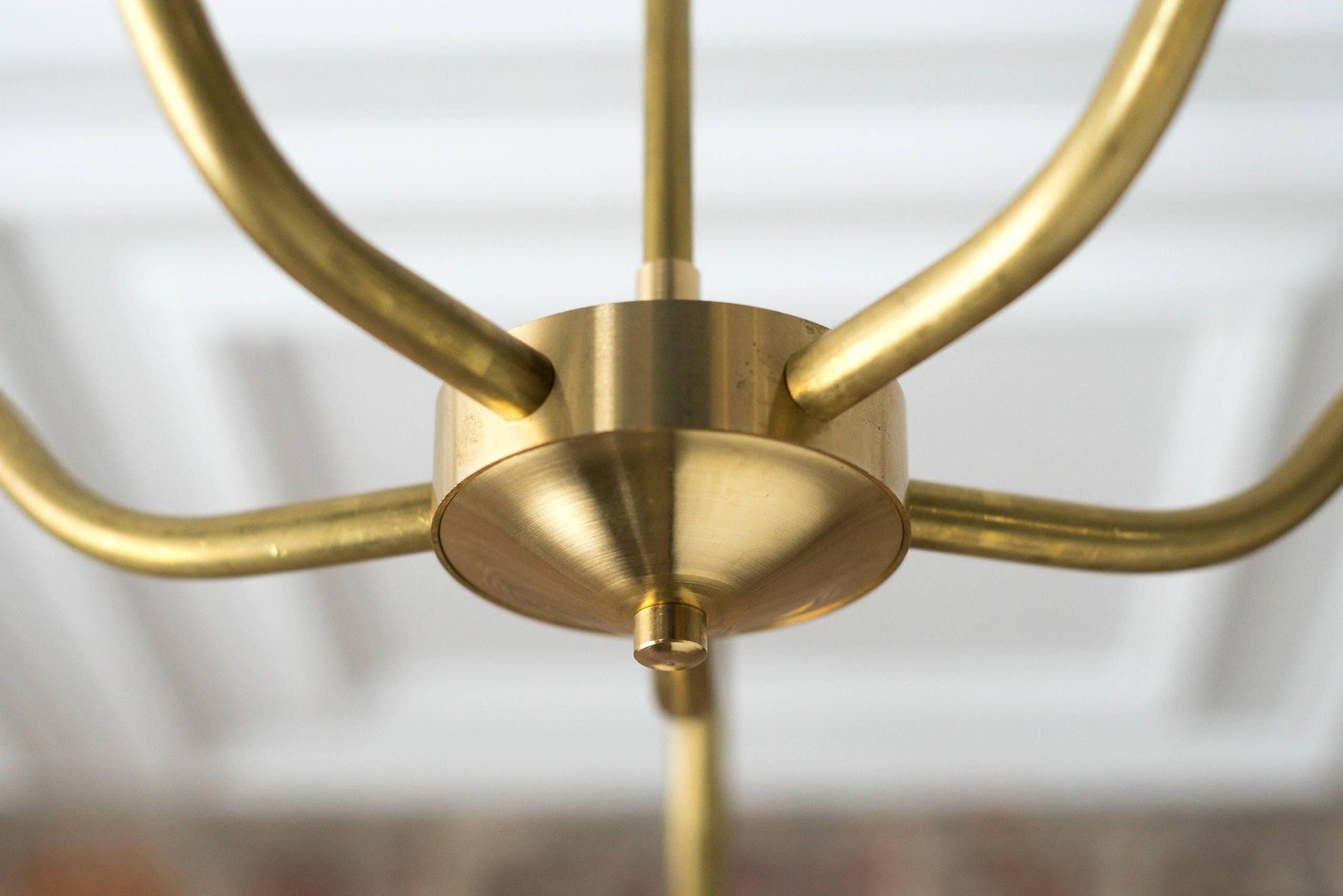 Mid-century modern raw brass chandelier with curved arms and central cylindrical hub. - CHANDELIER MODEL NO. 2464