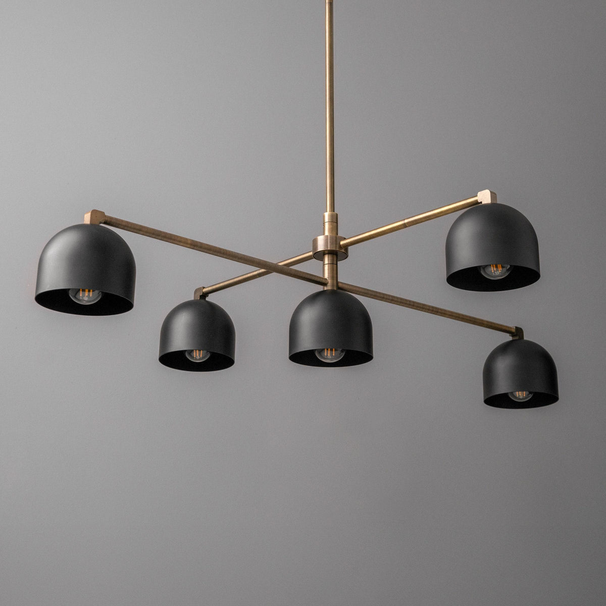 Mid century modern chandelier with five black dome shades and an antique brass frame. - CHANDELIER MODEL NO. 4267