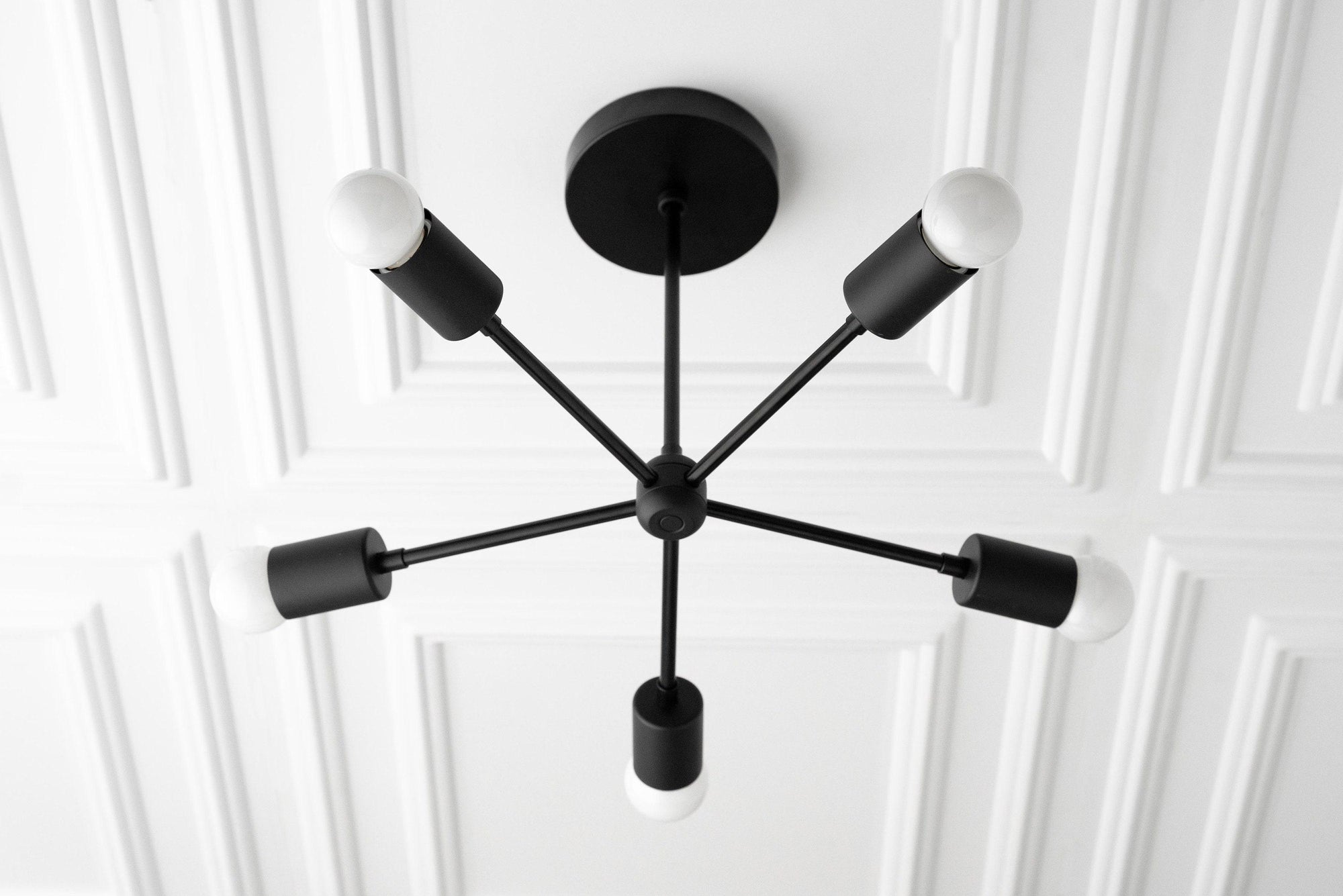 Mid-century modern black metal chandelier with five exposed bulbs and a round ceiling mount. - CHANDELIER MODEL NO. 6652