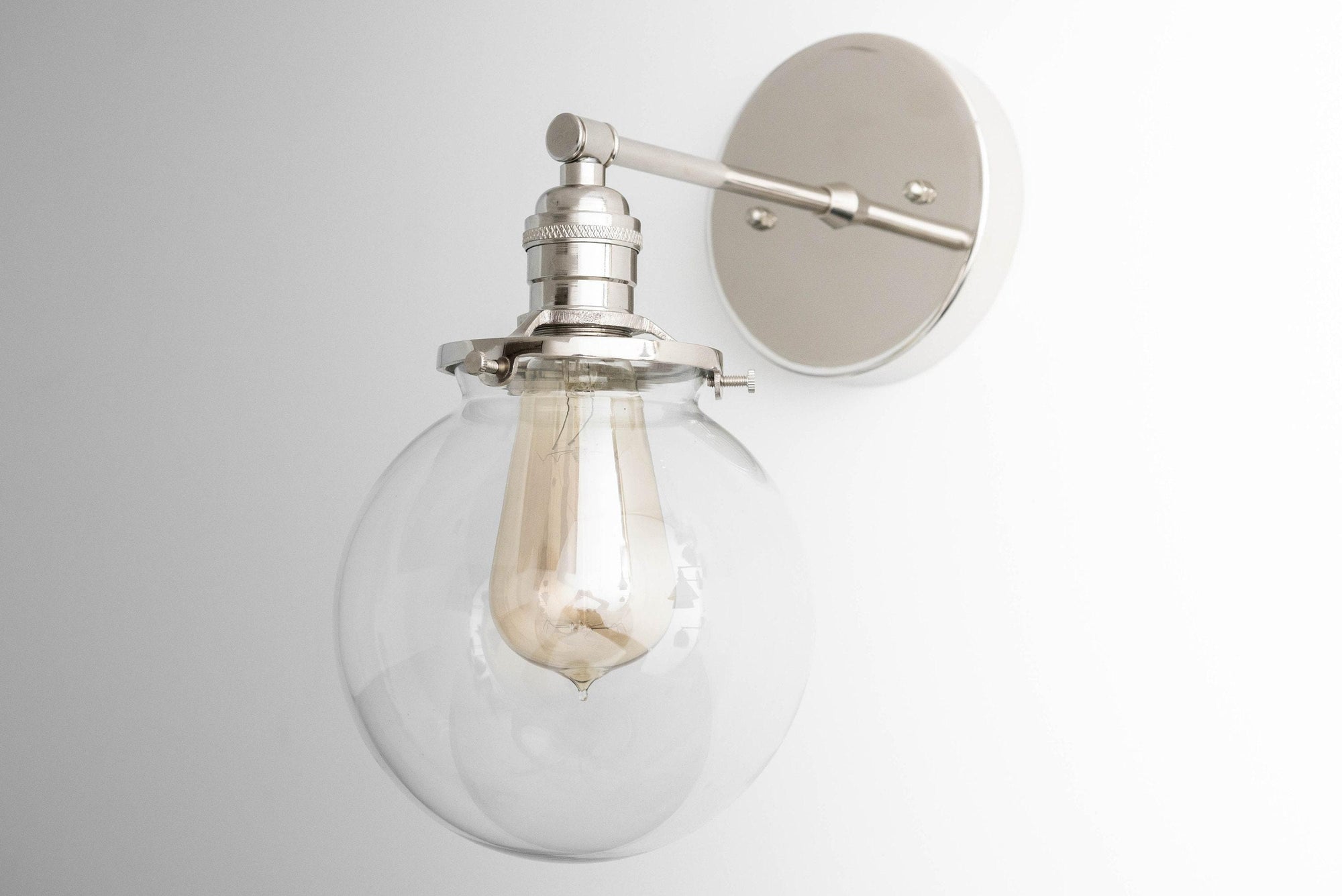 Mid-century modern semi-flush wall sconce with clear glass globe and brushed nickel finish. - SCONCE MODEL NO. 5456