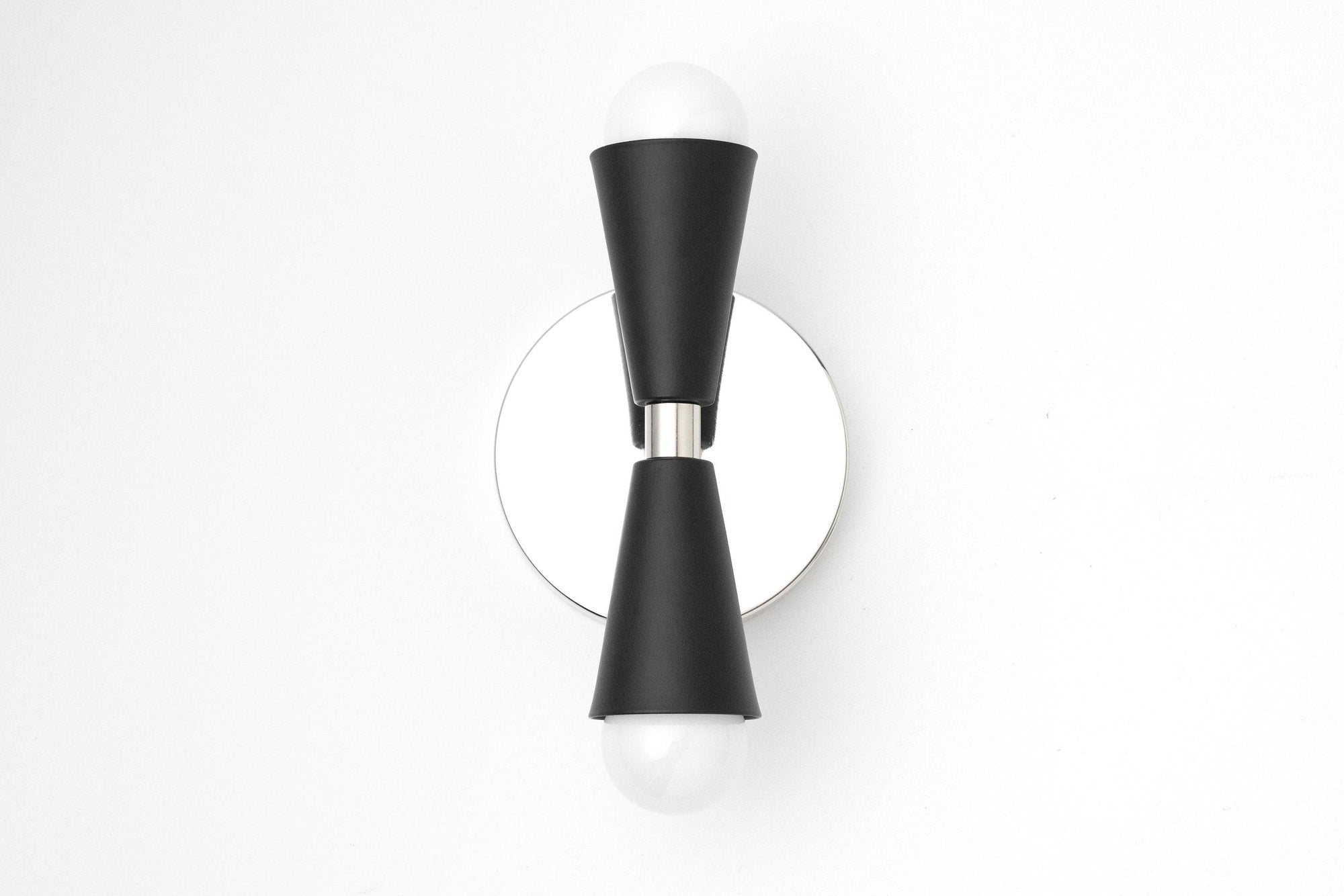 Mid-century modern black metal sconce with bare bulbs and round brushed nickel backplate. - SCONCE MODEL NO. 4717