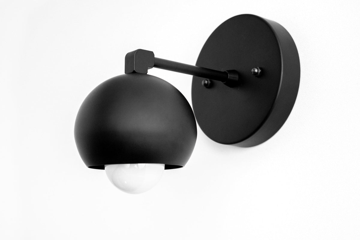 Black mid-century modern semi-flush wall sconce with matte globe shade and round backplate. - SCONCE MODEL NO. 0053