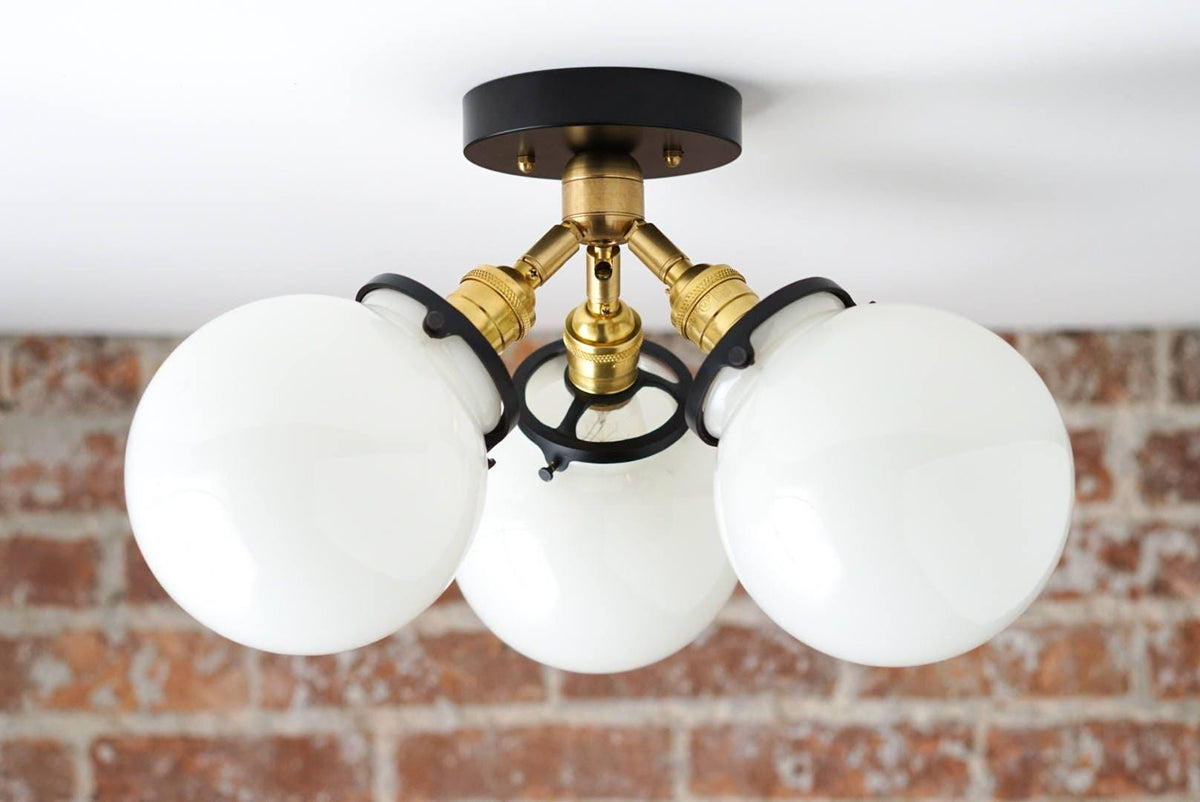 Mid-century modern flush mount ceiling light with three white glass globes and black and brass metal accents. - CEILING LIGHT MODEL NO. 0210