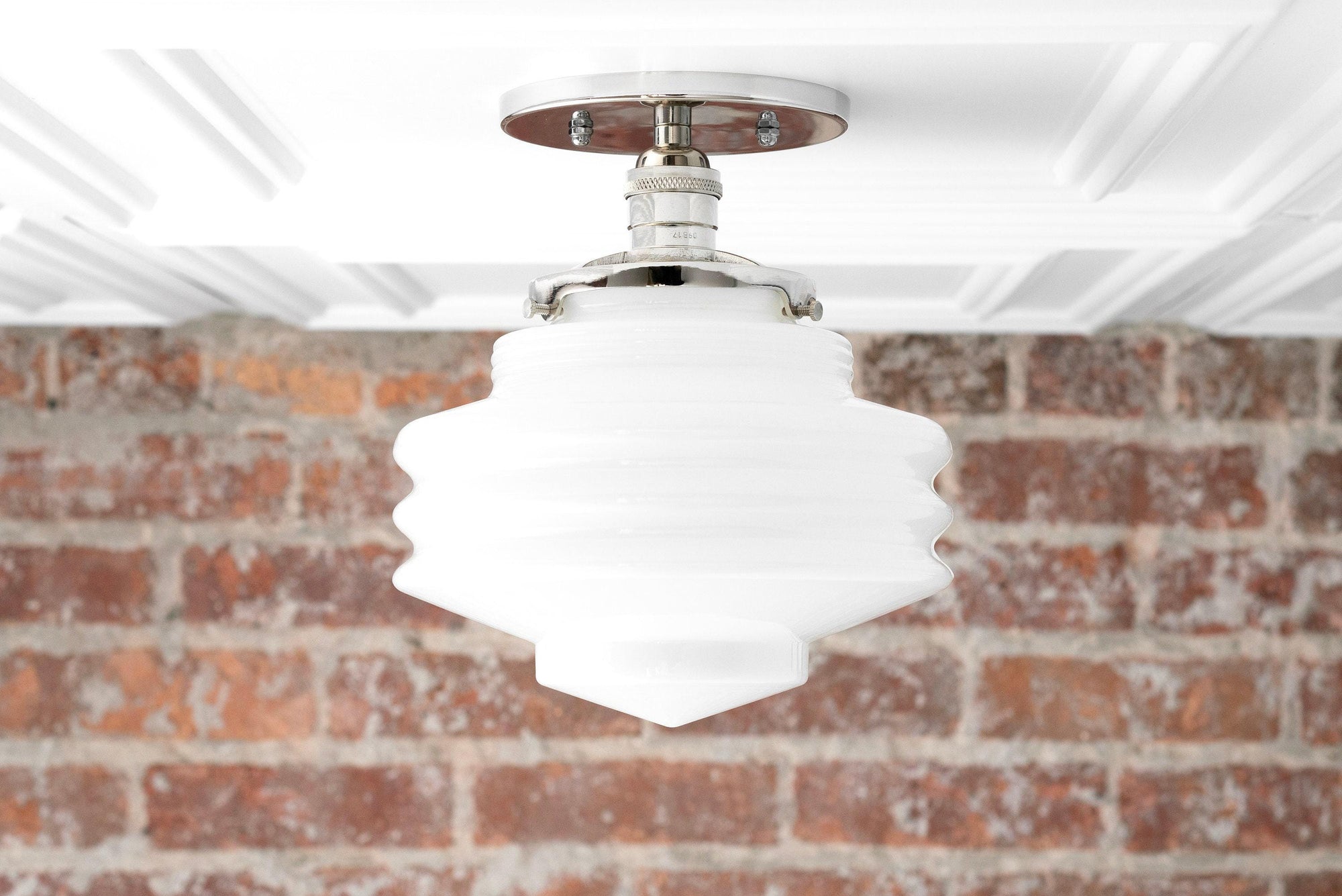 Mid-century modern semi-flush ceiling light with white layered globe and polished nickel fixture against brick wall. - CEILING LIGHT MODEL NO. 8295