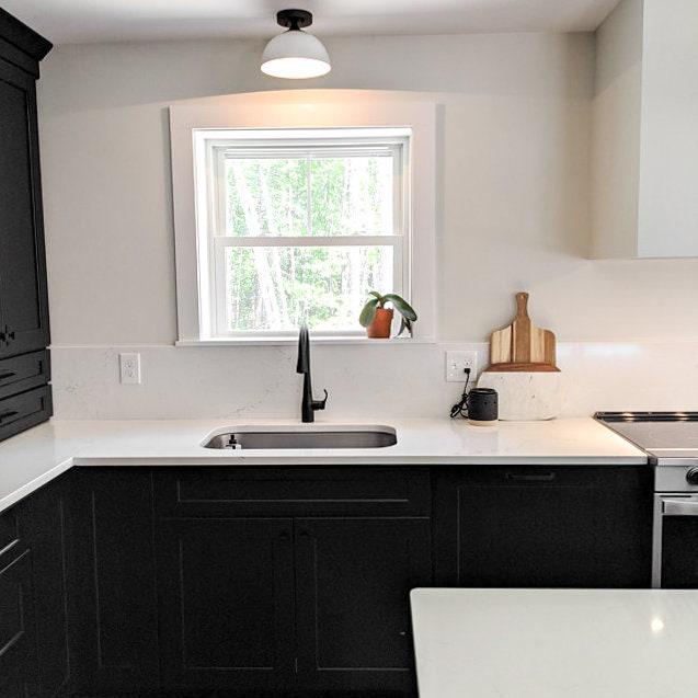 Semi-flush ceiling light with black metal base and white dome shade over kitchen sink. - CEILING LIGHT MODEL NO. 8510