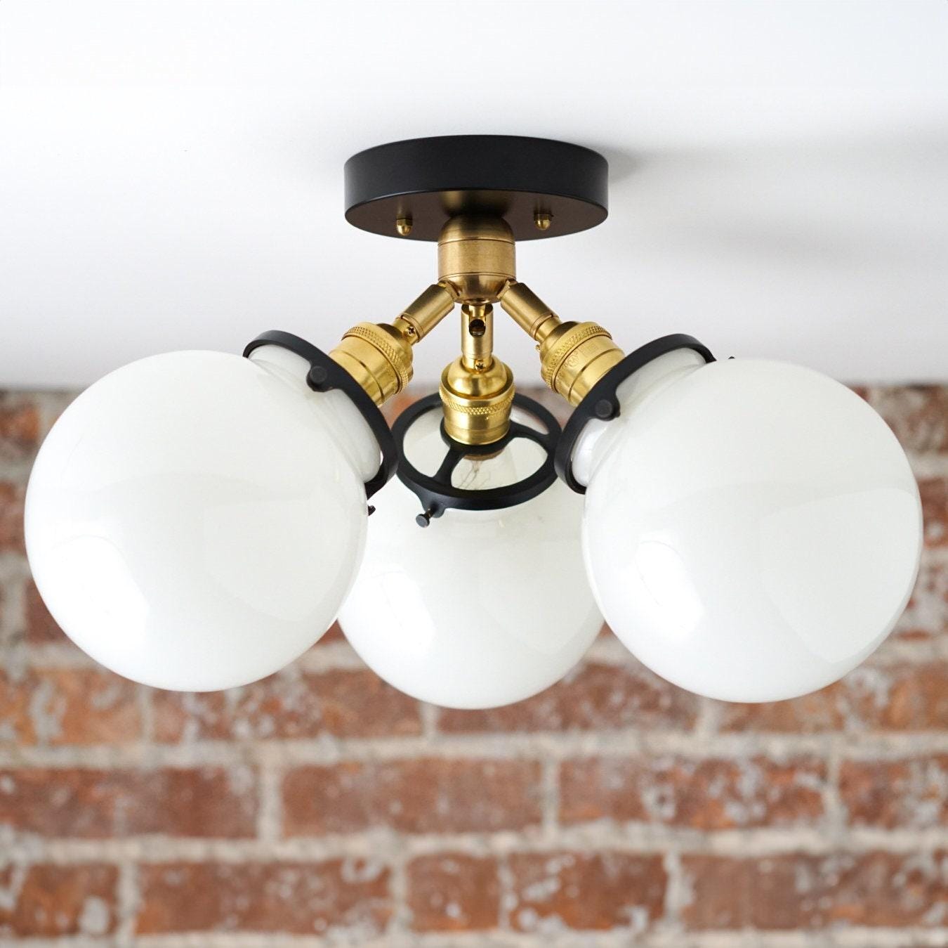 Mid-century flush mount ceiling light with three white glass globes and black and brass fixture. - CEILING LIGHT MODEL NO. 0210