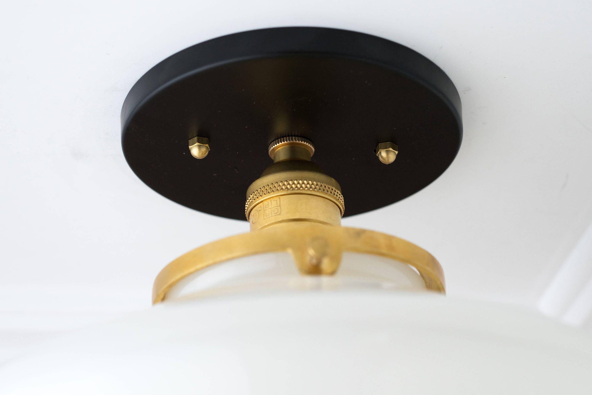 Mid-century semi-flush ceiling light with white globe and black, raw brass fixture details. - CEILING LIGHT MODEL NO. 5754