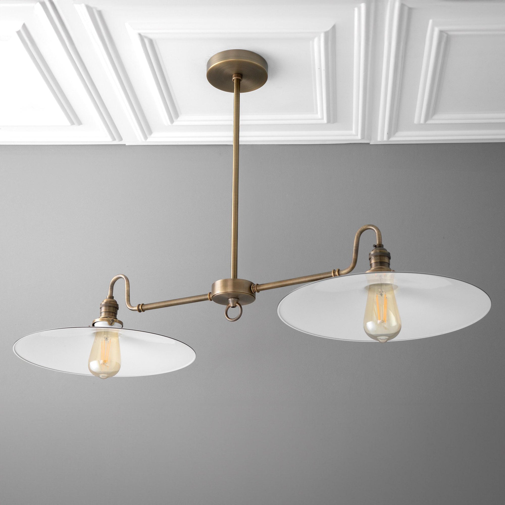 Industrial-style chandelier with two wide white glass shades and antique brass fixture. - CHANDELIER MODEL NO. 8785