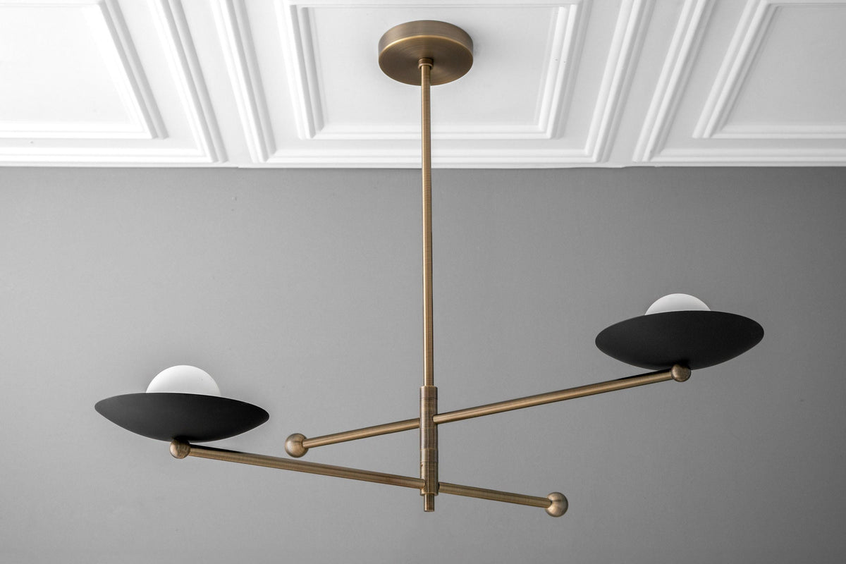 Mid-century modern chandelier with swiveling brass arms and two black dome shades with white diffusers. - CHANDELIER MODEL NO. 2933